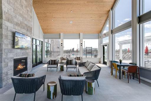 Relax in the enclosed 3-season patio near the pool.