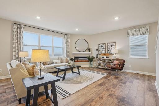Inviting family room. *This home will have a gas fireplace. Model photo, options and colors may vary.