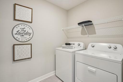 Upstairs laundry room makes this chore feel a little less like work. Model photo, options and colors may vary.