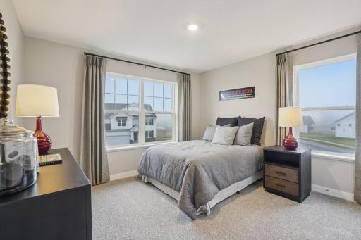 3 secondary bedrooms are all big and spaced out in each corner of the upstairs. Model photo, options and colors may vary.