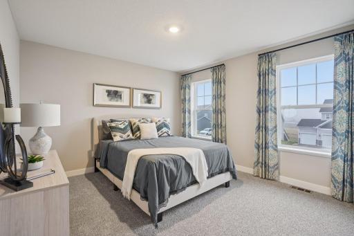 3 secondary bedrooms are all big and spaced out in each corner of the upstairs. Model photo, options and colors may vary.