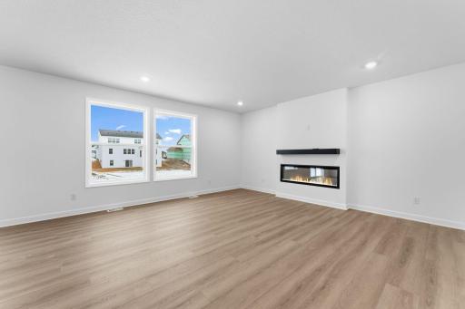 (Photo of a similar home, actual finishes may vary) The Great Room is a natural gathering space within the home where residents can curl up on the couch and enjoy a good book or movie with loved ones.