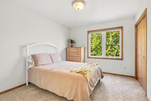 Well-sized upper-level third bedroom with a bright and airy feel!