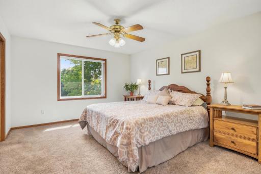 Unwind in the private primary suite showcasing a large walk-in closet and ensuite bathroom!