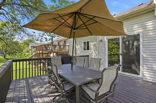 Enjoy outdoor living on the large deck with access to the patio and backyardâperfect for relaxing or entertaining