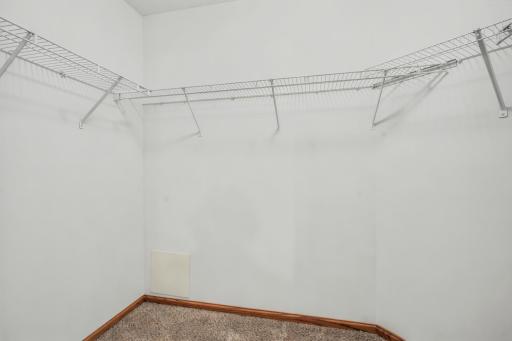 The expansive walk-in closet in the primary suite offers exceptional storage and organization