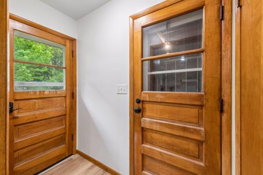 Door to backyard and door to attached garage
