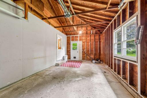 One car attached garage and door to backyard
