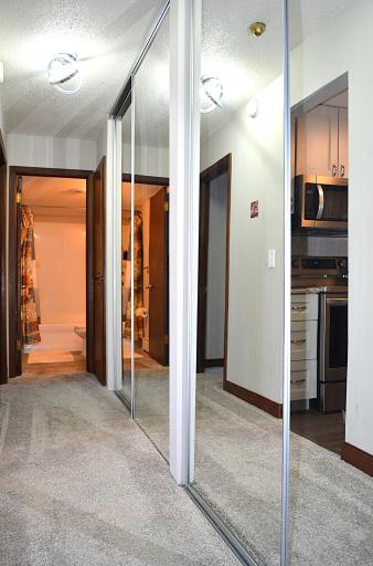 An Entire Wall of Floor to Ceiling Mirrored Closet Space