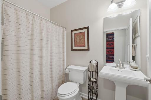 The full guest bathroom features beautifully finished details that give the space a polished, elevated feel.
A generously sized wall closet provides convenient, easily accessible storage for linens, towels and household essentials.