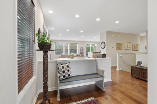 A spacious and inviting entry welcomes you into the home, with a thoughtfully placed knee wall creating a natural separation between the entry and formal dining area while maintaining an open feel.