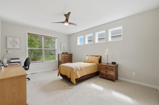 The main-level living room offers a comfortable place to unwind, while the unfinished lower level awaits your finishing touches and offers room to create additional space tailored to your needs.