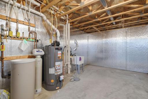 A spacious, well maintained utility room provides a clean, practical space for household needs and additional storage.