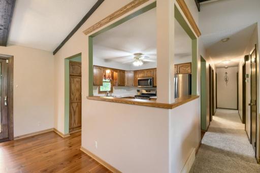 To the right is the hallway to the bedrooms and bathroom. The open feel from kitchen to the rest of the home makes it easier for entertaining or daily activities.