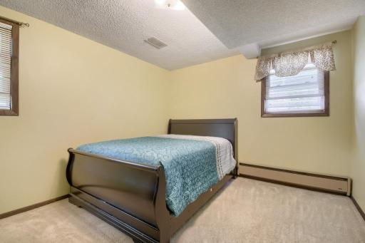 The 5th of 6 bedrooms, this room overlooks the backyard and side yard. The additional baseboard heat is supplemental to the forced air heat.