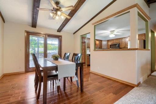 The dining room with hardwood floors offers plenty of space for a large table if desired. Step right outside to the large deck!