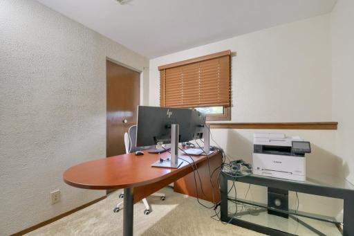 This 6th bedroom could serve a variety of purposes. It currently serves a home office.