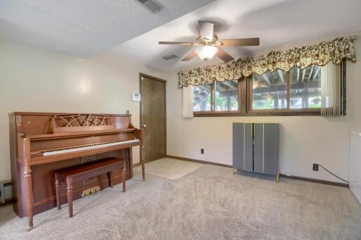 This space could serve as a place to play piano, a small gym area, or perhaps a foosball table! Access to the garage can be found through this door.