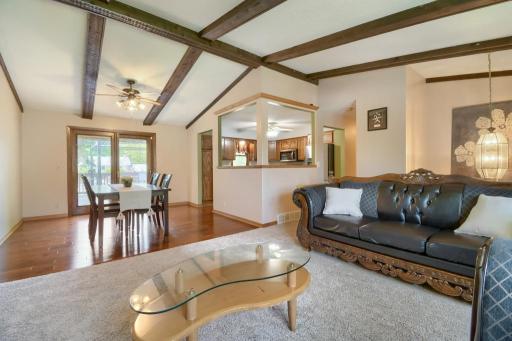 You will note the open feel to the living room, dining room and kitchen with the vaulted ceilings. Also, note the new carpet!