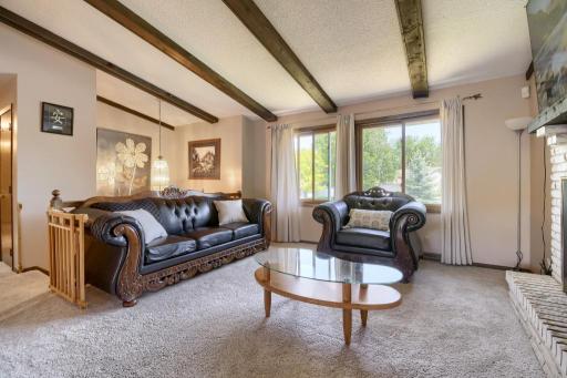 The living room looking the other direction. Note the ample lighting through the large windows.