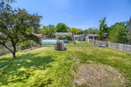 The backyard from the deck is fully fenced, flat and offer lots of play space!