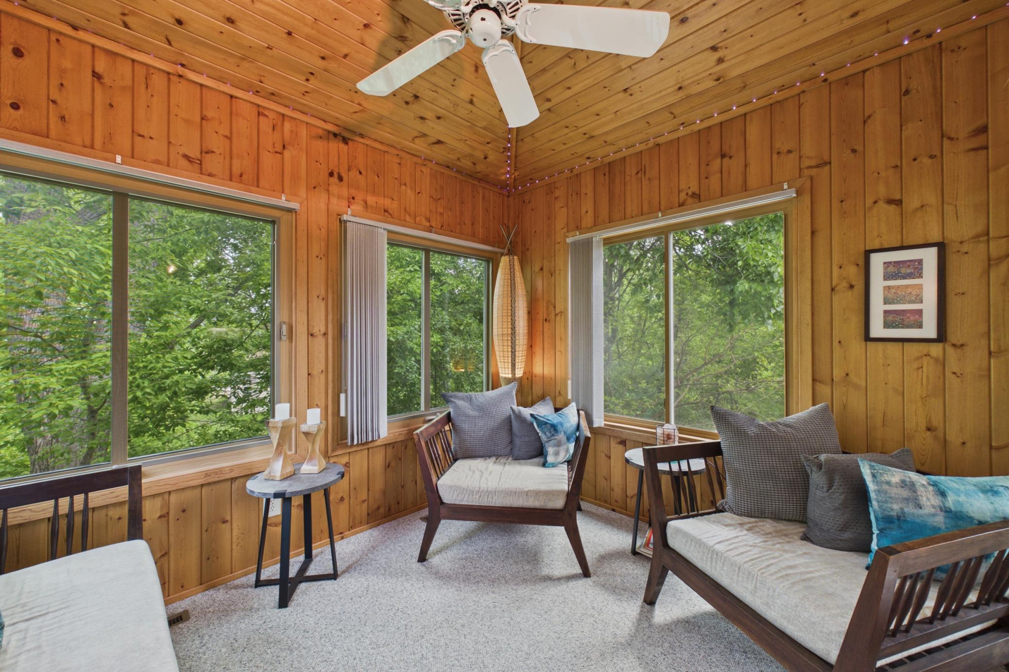 Cute porch surrounded by trees!