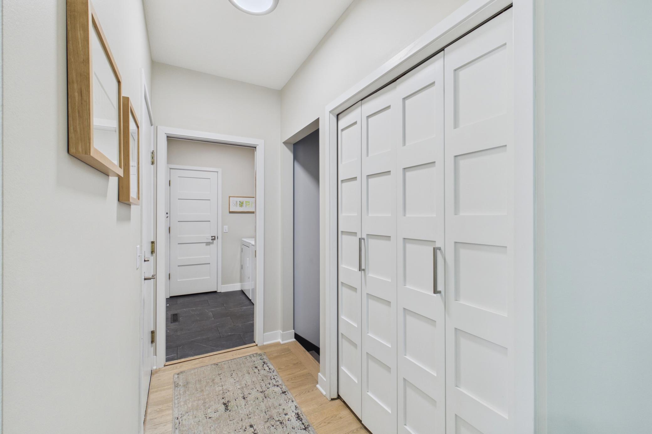 Entrance from the garage, gorgeous doors throughout!