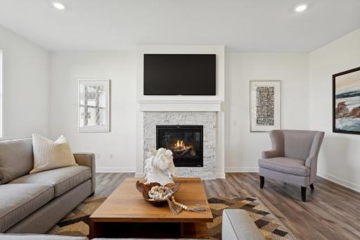 (Photo of a decorated model, actual homes finishes will vary) The stunning fireplace in the great room!