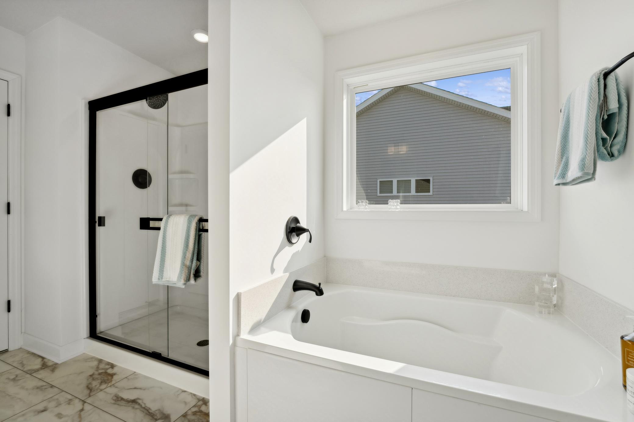 (Photo of a decorated model, actual homes finishes will vary) Another view of the primary bath.