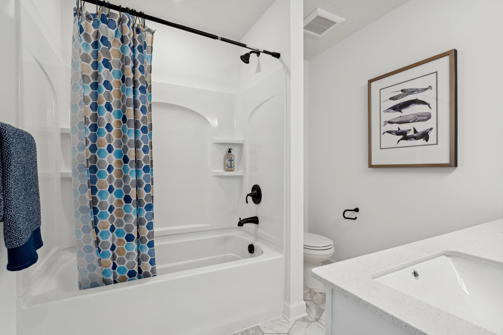 (Photo of a decorated model, actual homes finishes will vary) The secondary bath!