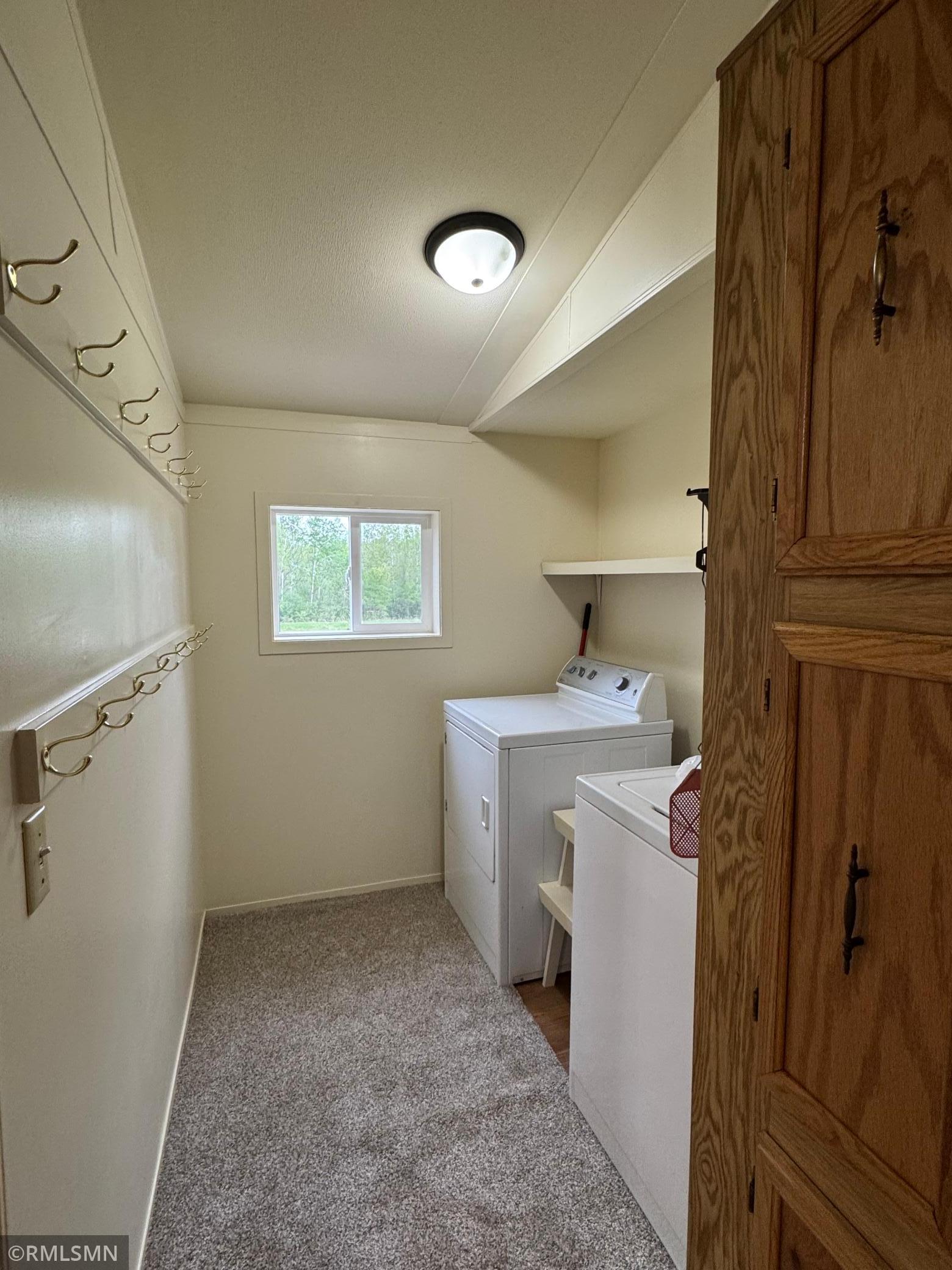 Main floor laundry room is located just off the kitchen.
