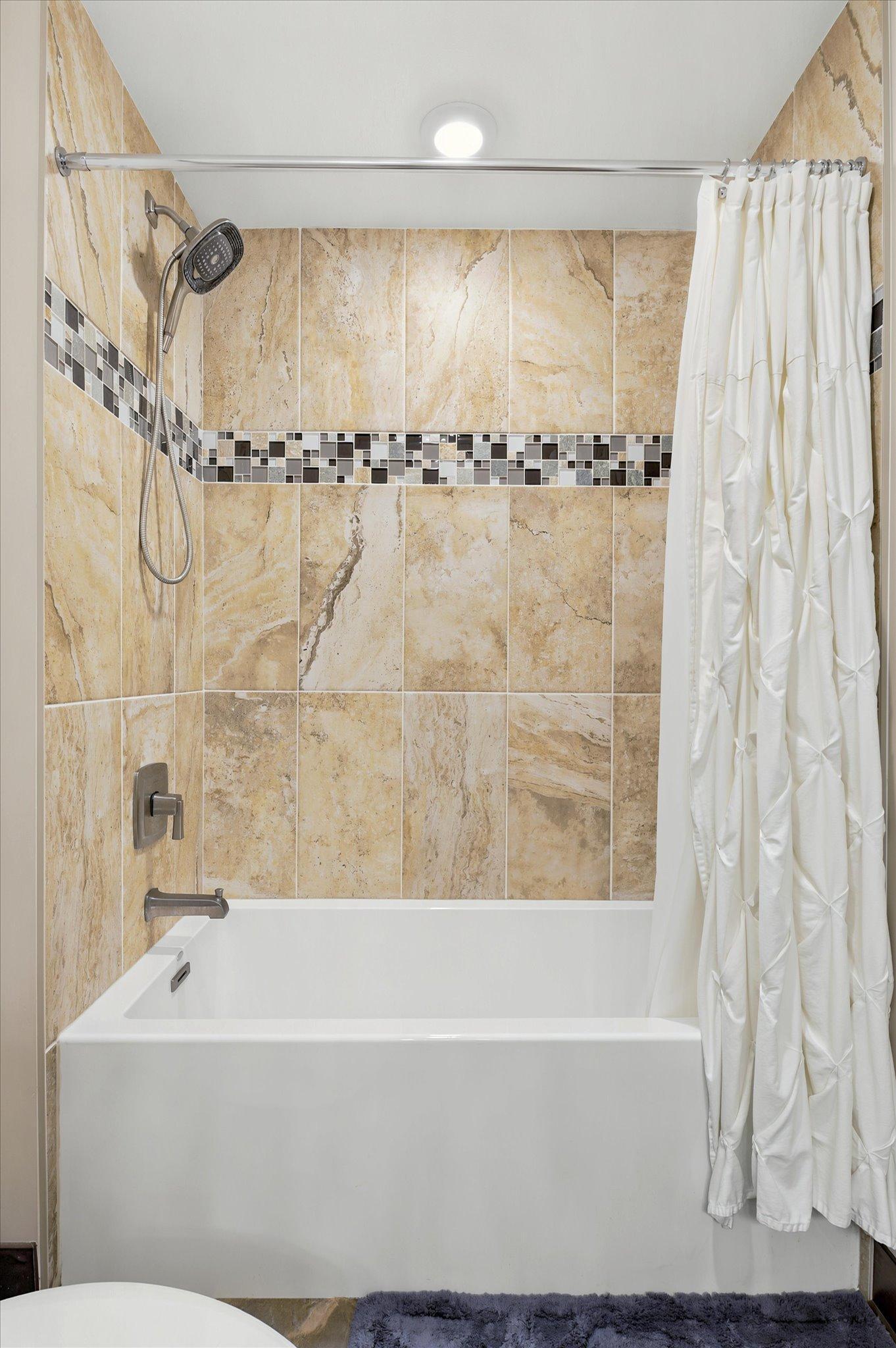 Soaking tub in the lower level full bath