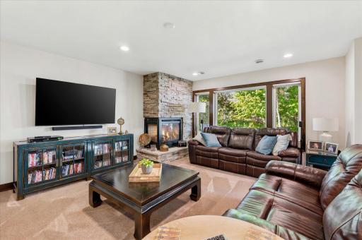Gas fireplace and wall of windows in the lower level family room