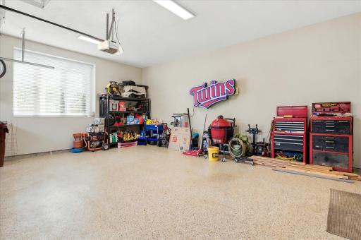 2 car garage with poly floors, insulated and sheet-rocked. Wired for electric vehicle and heat