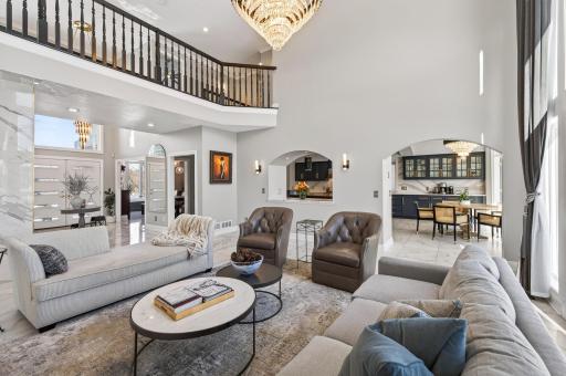 A different perspective from the main-level family room, featuring views of the foyer and nearby kitchen and dining room.