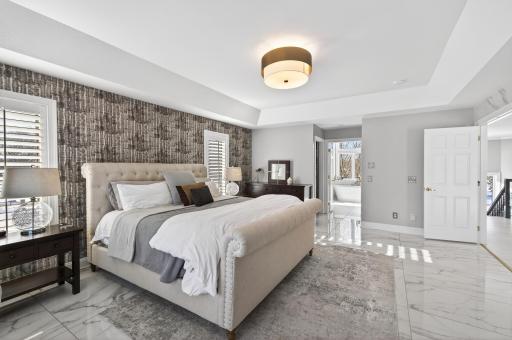 The upper level offers four bedrooms, highlighted by a spacious and inviting primary suite.