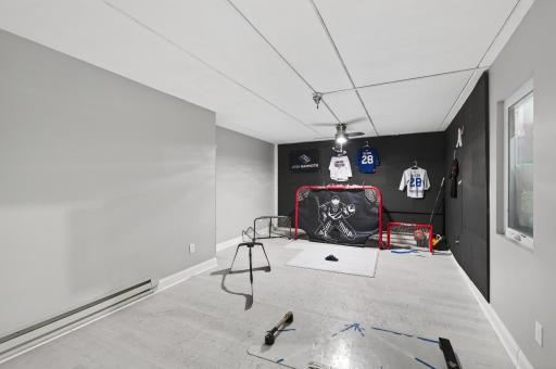 Completing the lower level is a nearby recreation room, and access to the tuck-under garage.