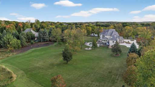 Beyond the fence, youâll find a large open green space and a dedicated fire pit area.