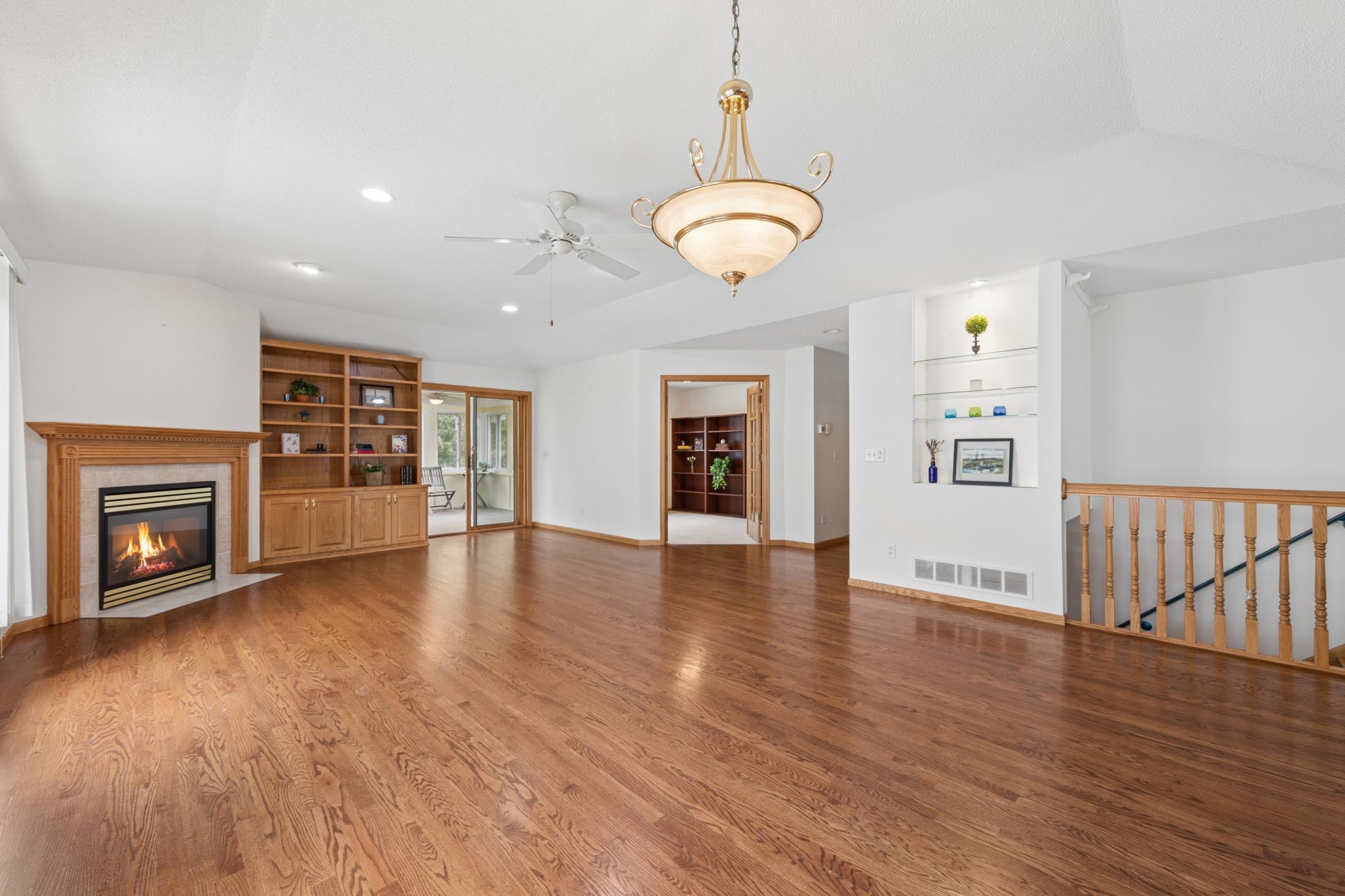 Vaulted Great Room with wood floors and builtins