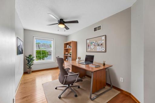 The versatile loft area offers the perfect flex space for a home office, play area, or additional living space.
