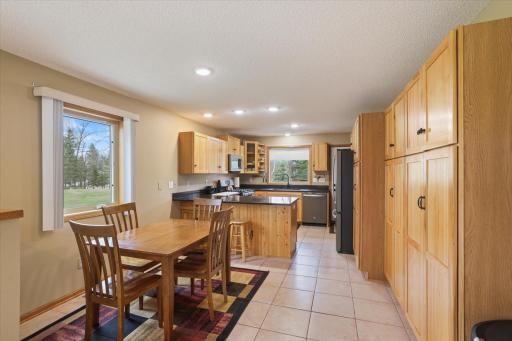 05 Kitchen with 2 sitting areas, counter top and dining area
