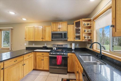 07-Granite countertops, stainless steel appliances, and gas stove