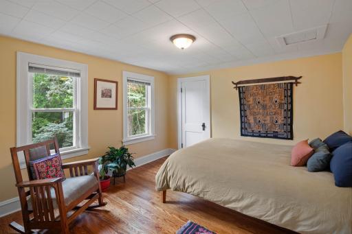 Fourth (upper level) bedroom with walk-in closet