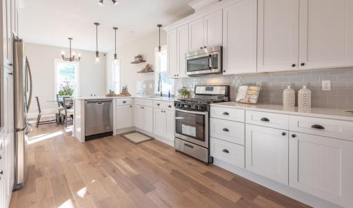 Centrally located Gourmet Kitchen is the Focal point of the main floor open-concept layout. This kitchen sure has loads of countertop space!