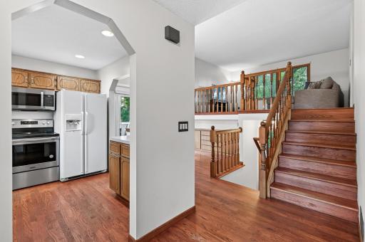 A welcoming multi-level entry creates a natural transition between the main, upper, and lower living spaces.