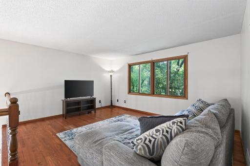 Bright and welcoming living room with a comfortable layout, perfect for relaxing and entertaining.