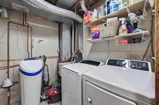 Unfinished laundry area offering functional space with excellent potential for storage, organization, and future improvements.