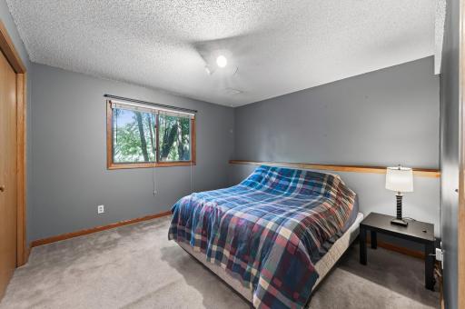 Bright and welcoming bedroom offering flexible space to accommodate a variety of needs and lifestyles.