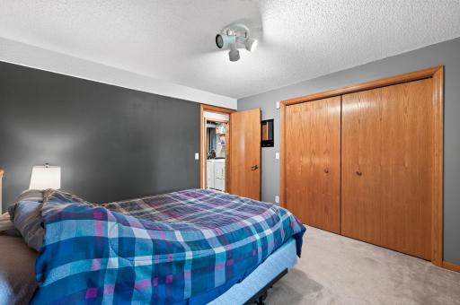 Versatile third bedroom with a comfortable layout, ideal for a guest room, office, or personal retreat.