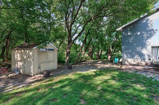 Mature trees and surrounding greenery add character to the property while providing a beautiful view from the backyard.